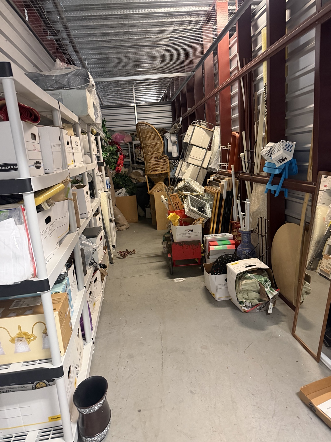Interior of a storage unit with remaining possessions during a partial cleanout